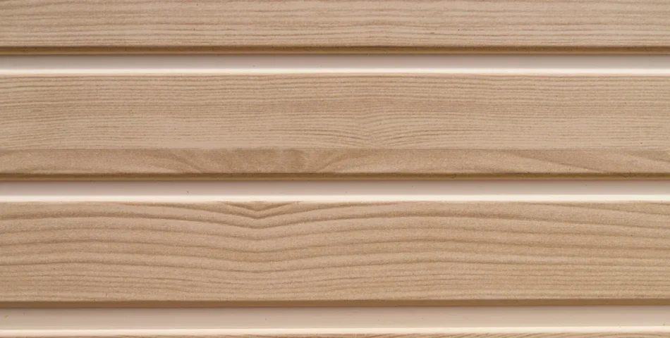 Close-up of beige wood-textured vinyl siding panels arranged horizontally with visible grain patterns and slight shadows between the panels.