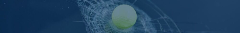 A yellow tennis ball caught in a net against a blue background.