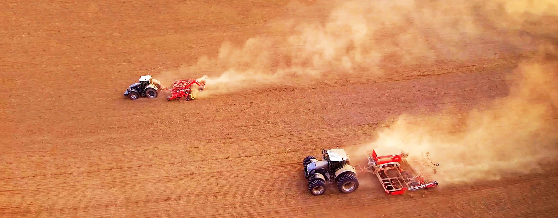 A group of tractors in a field.