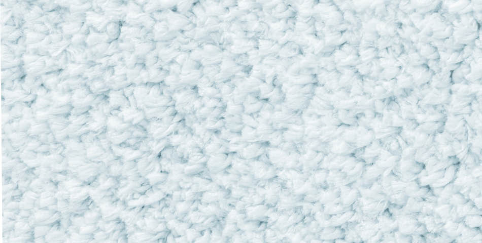 Close-up of a textured, light grey carpet with dense, looped fibers.