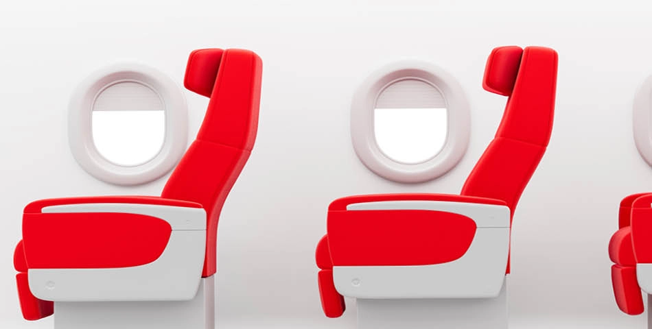 Two modern red and white airplane seats positioned side by side next to round windows on a white cabin wall.