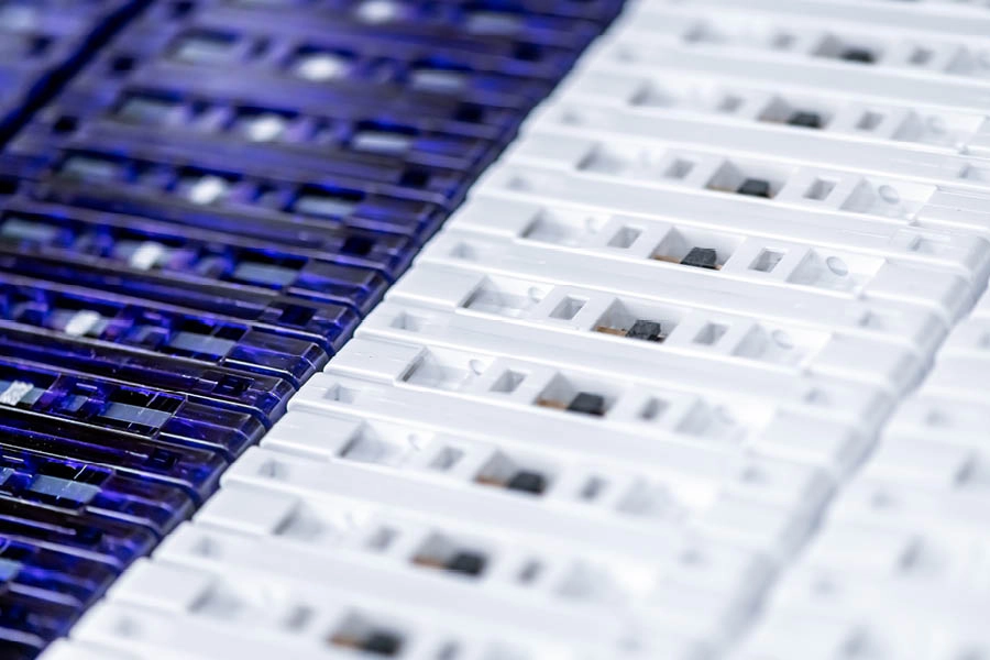 Rows of blue and white plastic rapid test cassette devices arranged in a close-up view.