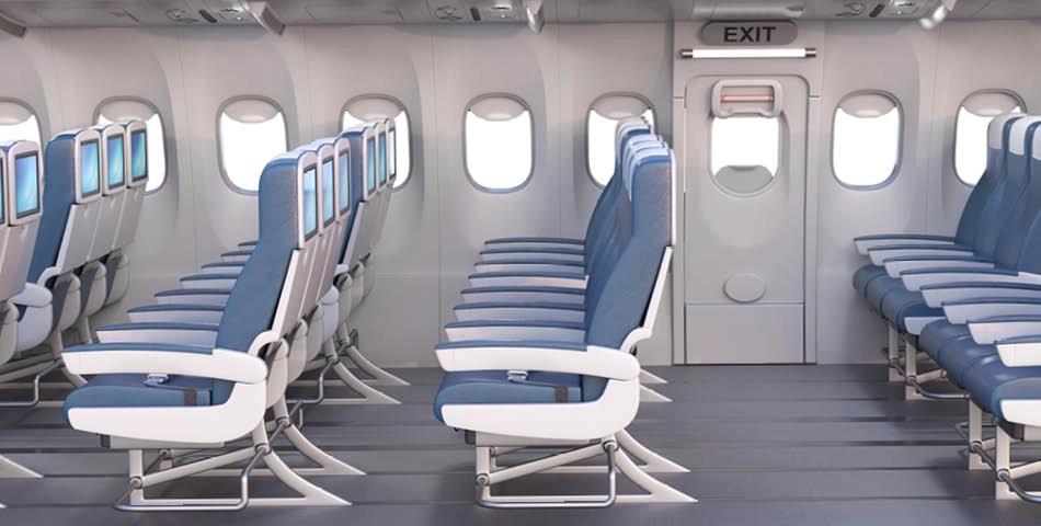 Empty airplane cabin showing rows of blue and white economy seats next to windows and an exit door at the rear of the cabin.
